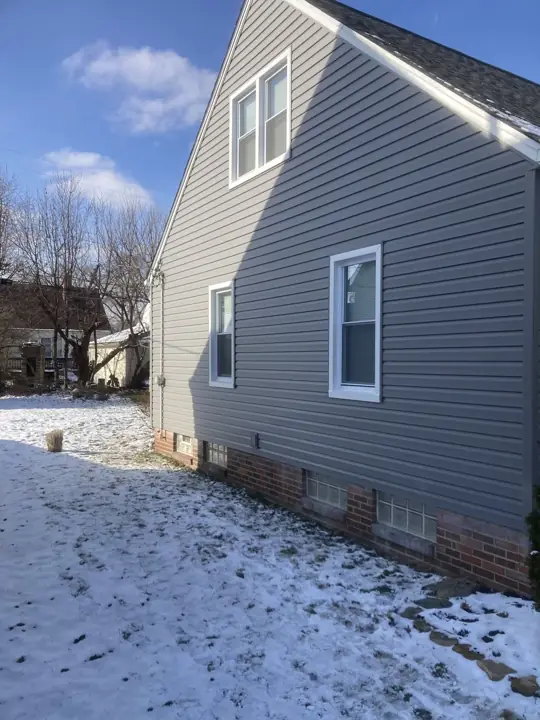Gray siding transformation, finished exterior view