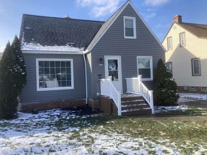 Gray siding exterior with white trim